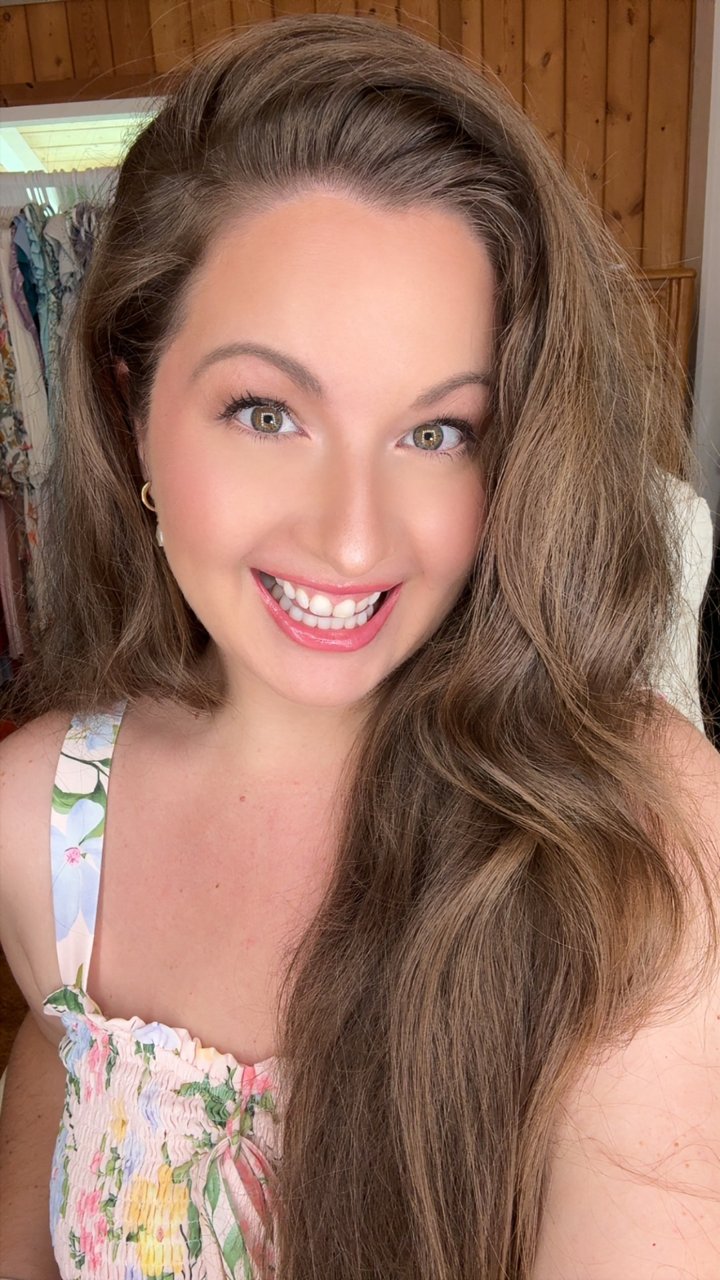 Amy smiling, wearing her bright eyes makeup look